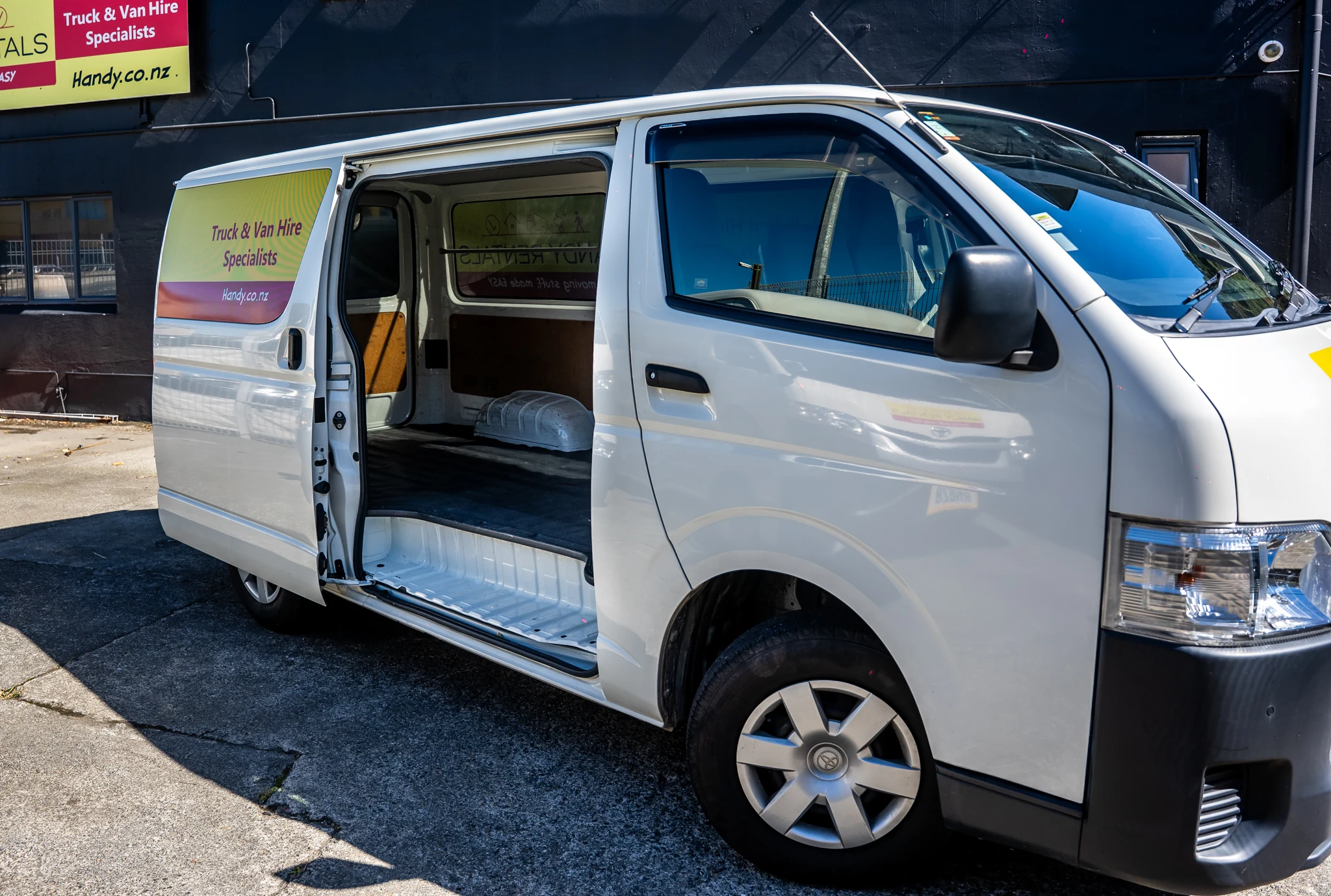 Small_cargo_van_side_door_open_cargo_space_image