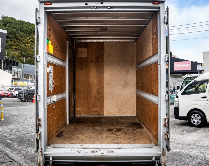 Small truck with tail lifter rear cargo space